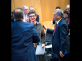 Rabbi Francine Roston is greeted by Paul Goldenberg and Mohammad Ali Chaudry 